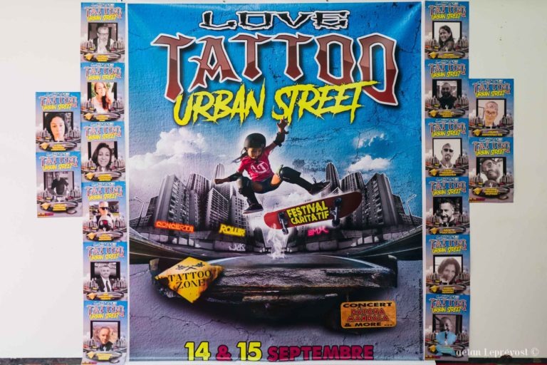 Une affiche colorée présente le festival « Love Tattoo Urban Street », avec un skateur en plein vol sur fond de paysage urbain. L'événement est prévu les 14 et 15 septembre à La Teste-de-Buch. Autour de l'affiche principale se trouvent des photos plus petites de personnes, probablement des participants ou des artistes, portant des dessins sur le thème du tatouage.